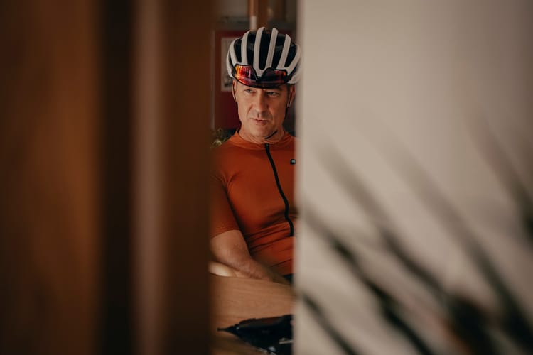 Cyclist in a hotel getting ready to ride his bike